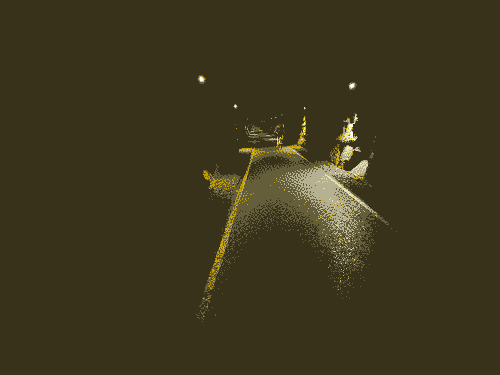 A single track road runs through a dark tunnel, lights are dotted along on either side of the walls to provide visibility.